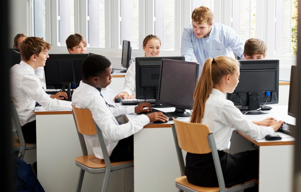 Student using computers that were acquired through the Connect the Classroom programme.